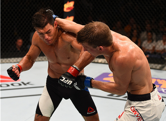 SAN DIEGO, CA - JULY 15:   (R-L) Matt Dwyer of Canada punches Alan Jouban in their welterweight bout during the UFC event at the Valley View Casino Center on July 15, 2015 in San Diego, California. (Photo by Jeff Bottari/Zuffa LLC/Zuffa LLC via Getty Imag