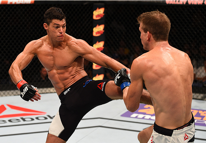 SAN DIEGO, CA - JULY 15:   (L-R) Alan Jouban kicks Matt Dwyer of Canada in their welterweight bout during the UFC event at the Valley View Casino Center on July 15, 2015 in San Diego, California. (Photo by Jeff Bottari/Zuffa LLC/Zuffa LLC via Getty Images