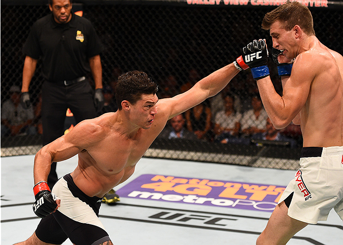 SAN DIEGO, CA - JULY 15: (L-R) Alan Jouban punches Matt Dwyer of Canada in their welterweight bout during the UFC event at the Valley View Casino Center on July 15, 2015 in San Diego, California. (Photo by Jeff Bottari/Zuffa LLC/Zuffa LLC via Getty Imag