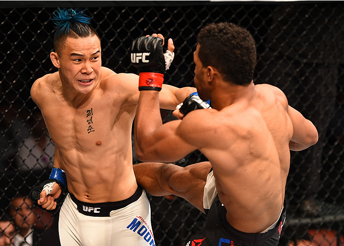 SAN DIEGO, CA - JULY 15:   (R-L) Kevin Lee kicks James Moontasri in their lightweight bout during the UFC event at the Valley View Casino Center on July 15, 2015 in San Diego, California. (Photo by Jeff Bottari/Zuffa LLC/Zuffa LLC via Getty Images)