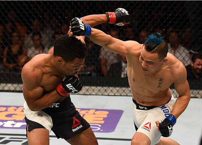 SAN DIEGO, CA - JULY 15: (R-L) James Moontasri punches Kevin Lee in their lightweight bout during the UFC event at the Valley View Casino Center on July 15, 2015 in San Diego, California. (Photo by Jeff Bottari/Zuffa LLC/Zuffa LLC via Getty Images)