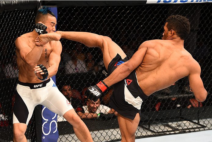 SAN DIEGO, CA - JULY 15:   (R-L) Kevin Lee kicks James Moontasri in their lightweight bout during the UFC event at the Valley View Casino Center on July 15, 2015 in San Diego, California. (Photo by Jeff Bottari/Zuffa LLC/Zuffa LLC via Getty Images)