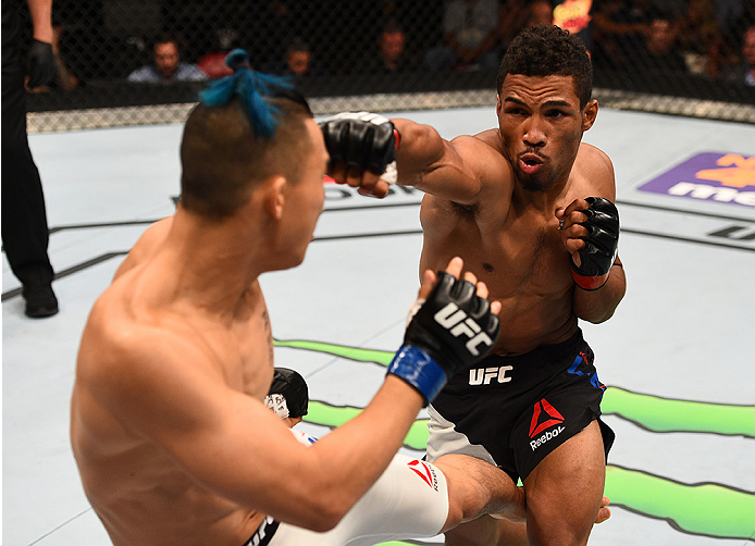 SAN DIEGO, CA - JULY 15: (R-L) Kevin Lee punches James Moontasri in their lightweight bout during the UFC event at the Valley View Casino Center on July 15, 2015 in San Diego, California. (Photo by Jeff Bottari/Zuffa LLC/Zuffa LLC via Getty Images)