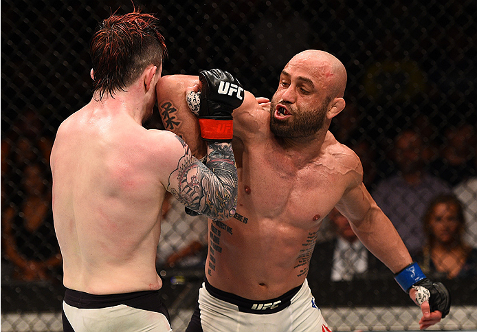 SAN DIEGO, CA - JULY 15:   (R-L) Manny Gamburyan elbows Scott Jorgensen in their flyweight bout during the UFC event at the Valley View Casino Center on July 15, 2015 in San Diego, California. (Photo by Jeff Bottari/Zuffa LLC/Zuffa LLC via Getty Images)