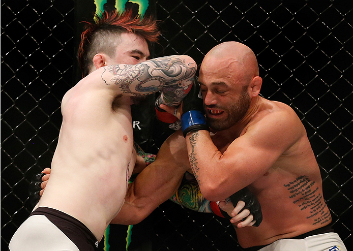 SAN DIEGO, CA - JULY 15:   (L-R) Scott Jorgensen elbows Manny Gamburyan in their flyweight bout during the UFC event at the Valley View Casino Center on July 15, 2015 in San Diego, California. (Photo by Todd Warshaw/Zuffa LLC/Zuffa LLC via Getty Images)