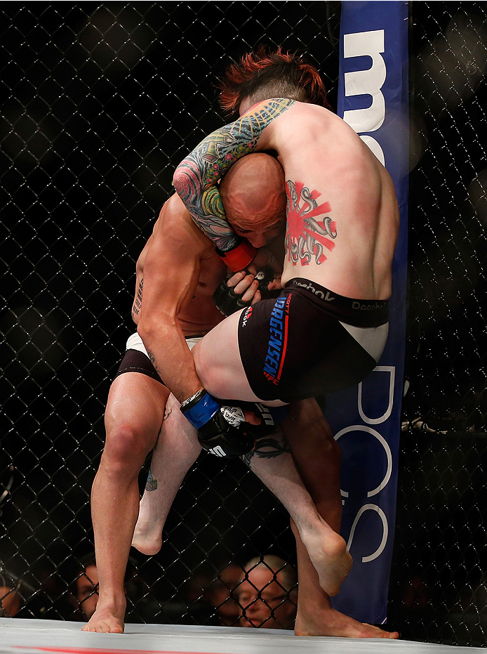 SAN DIEGO, CA - JULY 15:   (L-R) Manny Gamburyan takes down Scott Jorgensen in their flyweight bout during the UFC event at the Valley View Casino Center on July 15, 2015 in San Diego, California. (Photo by Todd Warshaw/Zuffa LLC/Zuffa LLC via Getty Image