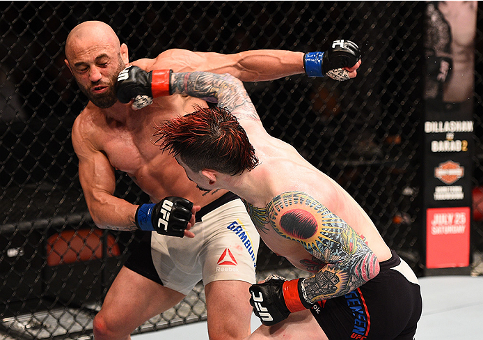 SAN DIEGO, CA - JULY 15:   (R-L) Scott Jorgensen punches Manny Gamburyan in their flyweight bout during the UFC event at the Valley View Casino Center on July 15, 2015 in San Diego, California. (Photo by Jeff Bottari/Zuffa LLC/Zuffa LLC via Getty Images)