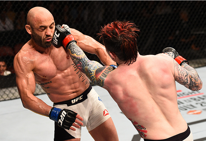 SAN DIEGO, CA - JULY 15:   (R-L) Scott Jorgensen punches Manny Gamburyan in their flyweight bout during the UFC event at the Valley View Casino Center on July 15, 2015 in San Diego, California. (Photo by Jeff Bottari/Zuffa LLC/Zuffa LLC via Getty Images)