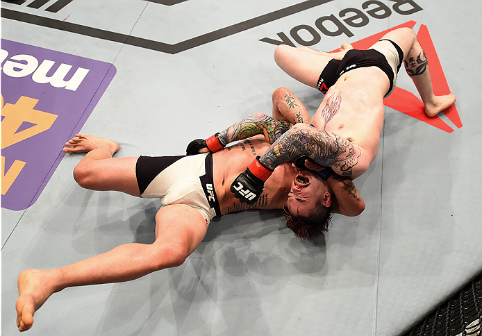 SAN DIEGO, CA - JULY 15:   (L-R) Manny Gamburyan attempts to submit Scott Jorgensen in their flyweight bout during the UFC event at the Valley View Casino Center on July 15, 2015 in San Diego, California. (Photo by Jeff Bottari/Zuffa LLC/Zuffa LLC via Get