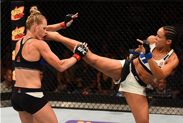 SAN DIEGO, CA - JULY 15:   (R-L) Marion Reneau kicks Holly Holm in their women's bantamweight bout during the UFC event at the Valley View Casino Center on July 15, 2015 in San Diego, California. (Photo by Jeff Bottari/Zuffa LLC/Zuffa LLC via Getty Images