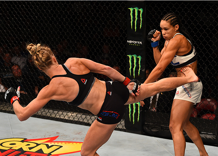 SAN DIEGO, CA - JULY 15: (L-R) Holly Holm kicks Marion Reneau in their women's bantamweight bout during the UFC event at the Valley View Casino Center on July 15, 2015 in San Diego, California. (Photo by Jeff Bottari/Zuffa LLC/Zuffa LLC via Getty Images
