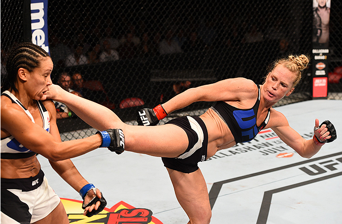 SAN DIEGO, CA - JULY 15: (R-L) Holly Holm kicks Marion Reneau in their women's bantamweight bout during the UFC event at the Valley View Casino Center on July 15, 2015 in San Diego, California. (Photo by Jeff Bottari/Zuffa LLC/Zuffa LLC via Getty Images