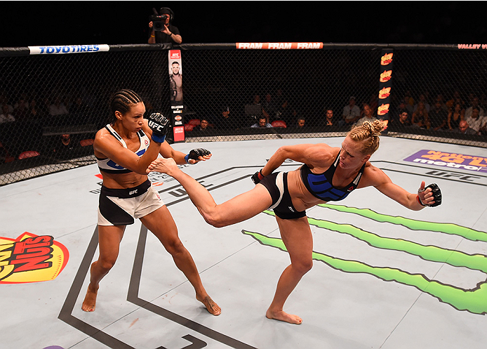 SAN DIEGO, CA - JULY 15:   (R-L) Holly Holm kicks Marion Reneau in their women's bantamweight bout during the UFC event at the Valley View Casino Center on July 15, 2015 in San Diego, California. (Photo by Jeff Bottari/Zuffa LLC/Zuffa LLC via Getty Images