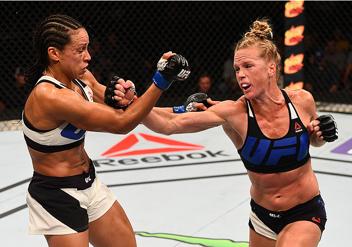 SAN DIEGO, CA - JULY 15:   (R-L) Holly Holm punches Marion Reneau in their women's bantamweight bout during the UFC event at the Valley View Casino Center on July 15, 2015 in San Diego, California. (Photo by Jeff Bottari/Zuffa LLC/Zuffa LLC via Getty Imag