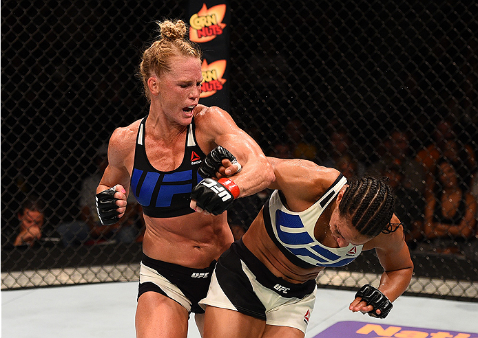 SAN DIEGO, CA - JULY 15:   (L-R) Holly Holm punches Marion Reneau in their women's bantamweight bout during the UFC event at the Valley View Casino Center on July 15, 2015 in San Diego, California. (Photo by Jeff Bottari/Zuffa LLC/Zuffa LLC via Getty Imag