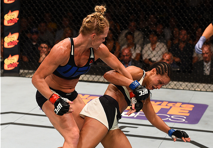 SAN DIEGO, CA - JULY 15:   (L-R) Holly Holm punches Marion Reneau in their women's bantamweight bout during the UFC event at the Valley View Casino Center on July 15, 2015 in San Diego, California. (Photo by Jeff Bottari/Zuffa LLC/Zuffa LLC via Getty Imag