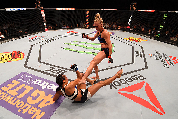 SAN DIEGO, CA - JULY 15:   Holly Holm (top) kicks Marion Reneau in their women's bantamweight bout during the UFC event at the Valley View Casino Center on July 15, 2015 in San Diego, California. (Photo by Jeff Bottari/Zuffa LLC/Zuffa LLC via Getty Images