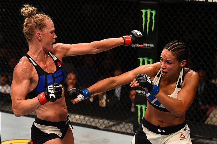 SAN DIEGO, CA - JULY 15:   (L-R) Holly Holm exchanges punches with Marion Reneau in their women's bantamweight bout during the UFC event at the Valley View Casino Center on July 15, 2015 in San Diego, California. (Photo by Jeff Bottari/Zuffa LLC/Zuffa LLC