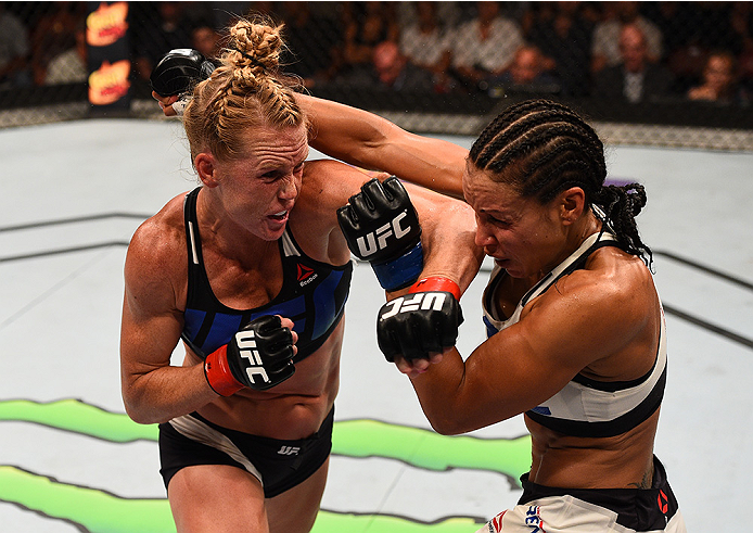 SAN DIEGO, CA - JULY 15:   (L-R) Holly Holm punches Marion Reneau in their women's bantamweight bout during the UFC event at the Valley View Casino Center on July 15, 2015 in San Diego, California. (Photo by Jeff Bottari/Zuffa LLC/Zuffa LLC via Getty Imag