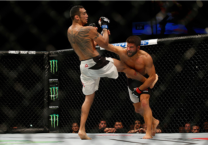 SAN DIEGO, CA - JULY 15: (R-L) Josh Thomson punches Tony Ferguson in their lightweight bout during the UFC event at the Valley View Casino Center on July 15, 2015 in San Diego, California. (Photo by Todd Warshaw/Zuffa LLC/Zuffa LLC via Getty Images)