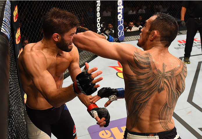 SAN DIEGO, CA - JULY 15:  (R-L) Tony Ferguson elbows Josh Thomson in their lightweight bout during the UFC event at the Valley View Casino Center on July 15, 2015 in San Diego, California. (Photo by Jeff Bottari/Zuffa LLC/Zuffa LLC via Getty Images)