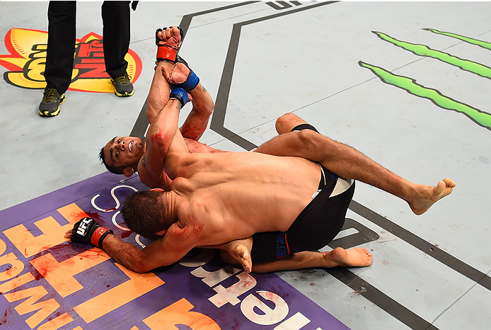 SAN DIEGO, CA - JULY 15: (L-R) Tony Ferguson attempts to submit Josh Thomson in their lightweight bout during the UFC event at the Valley View Casino Center on July 15, 2015 in San Diego, California. (Photo by Jeff Bottari/Zuffa LLC/Zuffa LLC via Getty I