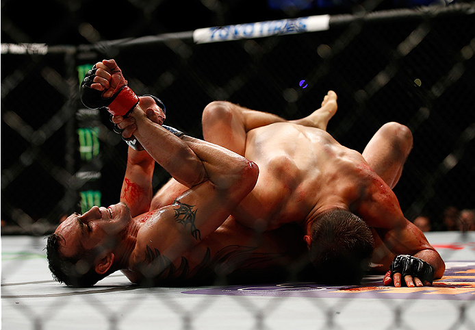 SAN DIEGO, CA - JULY 15: (L-R) Tony Ferguson attempts to submit Josh Thomson in their lightweight bout during the UFC event at the Valley View Casino Center on July 15, 2015 in San Diego, California. (Photo by Todd Warshaw/Zuffa LLC/Zuffa LLC via Getty I