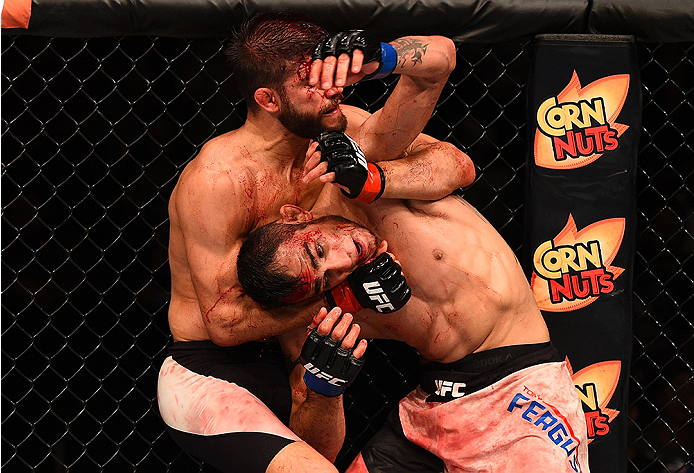 SAN DIEGO, CA - JULY 15: (R-L) Josh Thomson attempts to submit Tony Ferguson in their lightweight bout during the UFC event at the Valley View Casino Center on July 15, 2015 in San Diego, California. (Photo by Jeff Bottari/Zuffa LLC/Zuffa LLC via Getty I