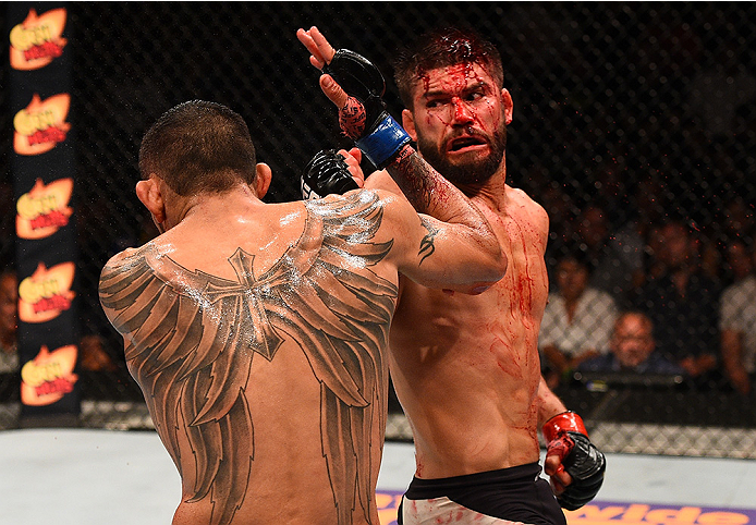 SAN DIEGO, CA - JULY 15: (R-L) Josh Thomson throws a spinning back fist at Tony Ferguson in their lightweight bout during the UFC event at the Valley View Casino Center on July 15, 2015 in San Diego, California. (Photo by Jeff Bottari/Zuffa LLC/Zuffa LLC