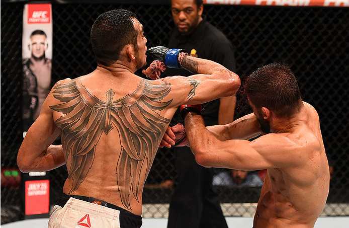 SAN DIEGO, CA - JULY 15: (L-R) Tony Ferguson elbows Josh Thomson in their lightweight bout during the UFC event at the Valley View Casino Center on July 15, 2015 in San Diego, California. (Photo by Jeff Bottari/Zuffa LLC/Zuffa LLC via Getty Images)