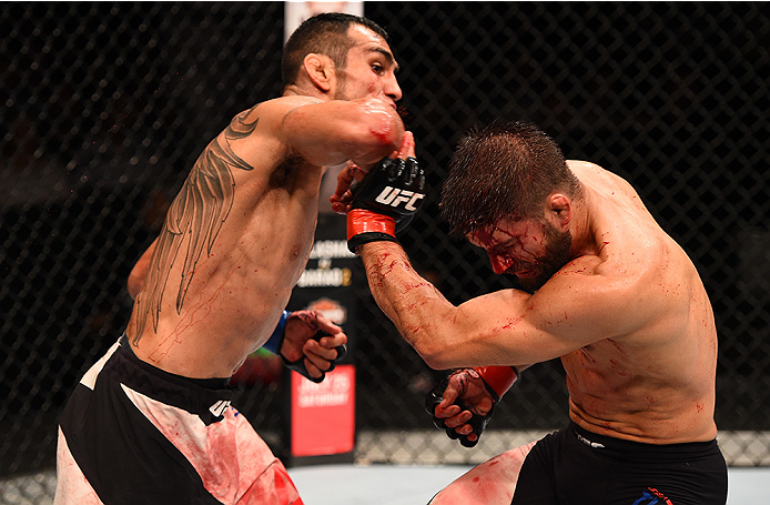 SAN DIEGO, CA - JULY 15:  (L-R) Tony Ferguson elbows Josh Thomson in their lightweight bout during the UFC event at the Valley View Casino Center on July 15, 2015 in San Diego, California. (Photo by Jeff Bottari/Zuffa LLC/Zuffa LLC via Getty Images)