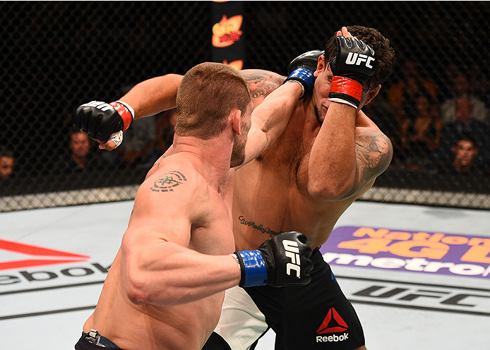 SAN DIEGO, CA - JULY 15: (L-R) Todd Duffee punches Frank Mir in their heavyweight bout during the UFC event at the Valley View Casino Center on July 15, 2015 in San Diego, California. (Photo by Jeff Bottari/Zuffa LLC/Zuffa LLC via Getty Images)