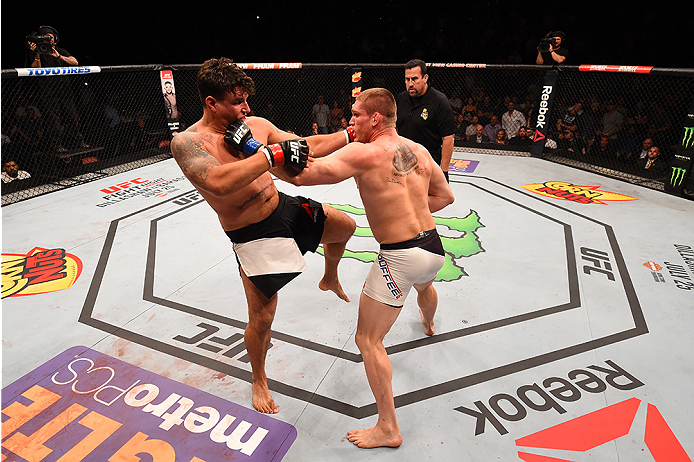 SAN DIEGO, CA - JULY 15:   (R-L) Todd Duffee punches Frank Mir in their heavyweight bout during the UFC event at the Valley View Casino Center on July 15, 2015 in San Diego, California. (Photo by Jeff Bottari/Zuffa LLC/Zuffa LLC via Getty Images)