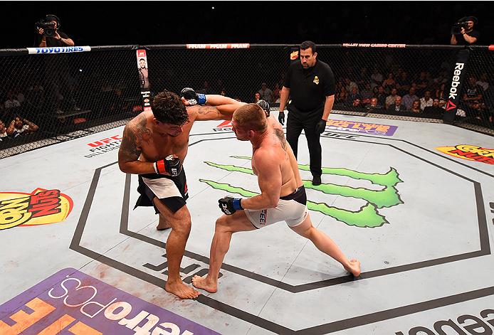 SAN DIEGO, CA - JULY 15:   (R-L) Todd Duffee exchanges punches with  Frank Mir in their heavyweight bout during the UFC event at the Valley View Casino Center on July 15, 2015 in San Diego, California. (Photo by Jeff Bottari/Zuffa LLC/Zuffa LLC via Getty 