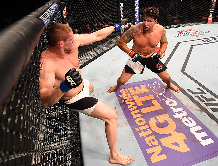 SAN DIEGO, CA - JULY 15:   (L-R) Todd Duffee punches Frank Mir in their heavyweight bout during the UFC event at the Valley View Casino Center on July 15, 2015 in San Diego, California. (Photo by Jeff Bottari/Zuffa LLC/Zuffa LLC via Getty Images)