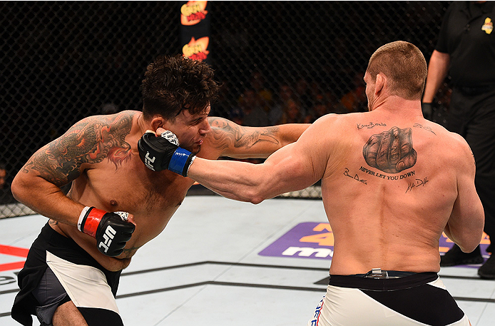 SAN DIEGO, CA - JULY 15:   (R-L) Todd Duffee punches Frank Mir in their heavyweight bout during the UFC event at the Valley View Casino Center on July 15, 2015 in San Diego, California. (Photo by Jeff Bottari/Zuffa LLC/Zuffa LLC via Getty Images)