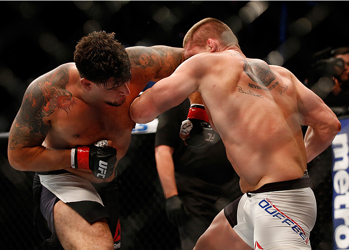 SAN DIEGO, CA - JULY 15:   (R-L) Todd Duffee punches Frank Mir in their heavyweight bout during the UFC event at the Valley View Casino Center on July 15, 2015 in San Diego, California. (Photo by Todd Warshaw/Zuffa LLC/Zuffa LLC via Getty Images)