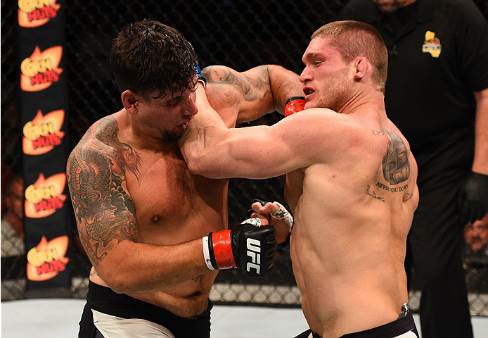 SAN DIEGO, CA - JULY 15:   (L-R) Frank Mir punches and knocks out Todd Duffee in their heavyweight bout during the UFC event at the Valley View Casino Center on July 15, 2015 in San Diego, California. (Photo by Jeff Bottari/Zuffa LLC/Zuffa LLC via Getty I