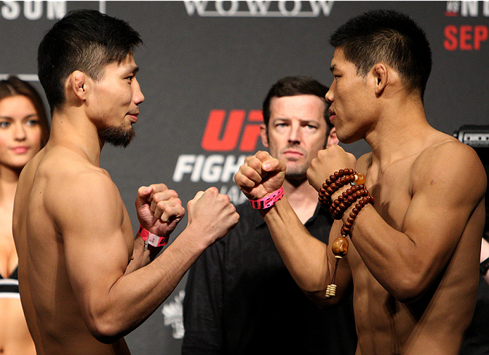 SAITAMA, JAPAN - SEPTEMBER 25: (L and R) Keita Nakamura and Li Jingliang during the UFC weigh-in at the Saitama Super Arena on September 25, 2015 in Saitama, Japan. (Photo by Mitch Viquez/Zuffa LLC/Zuffa LLC via Getty Images)