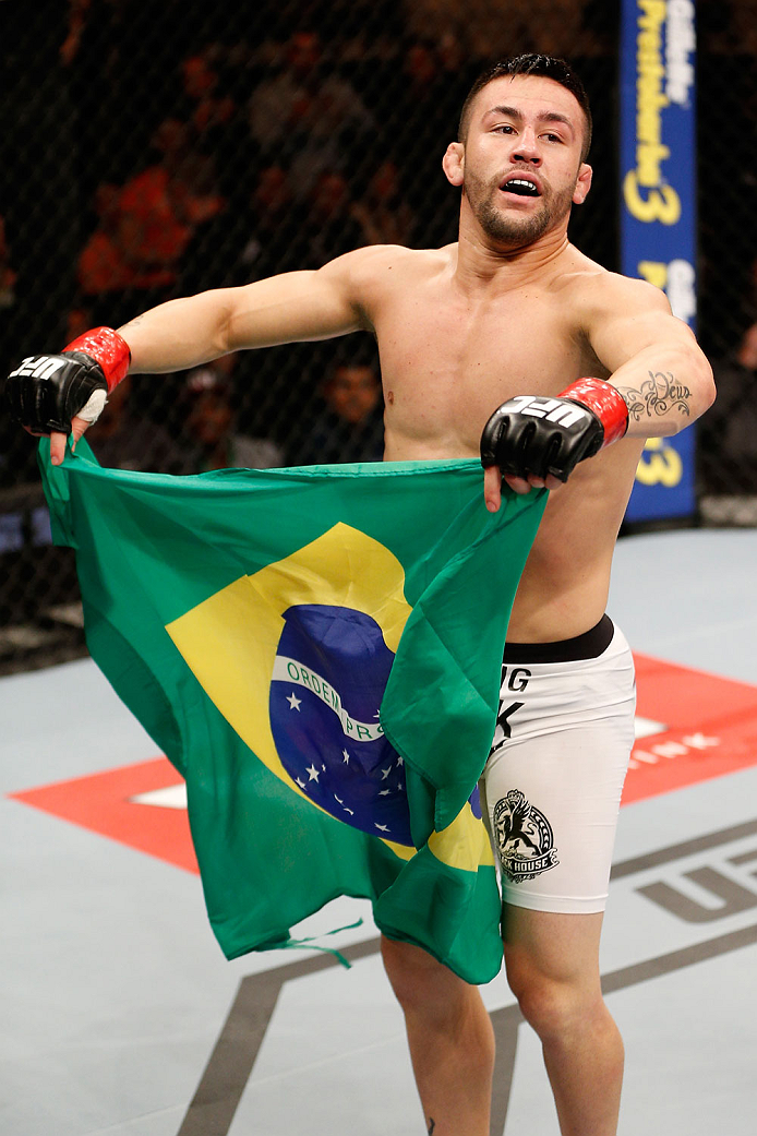 SAO PAULO, BRAZIL - MAY 31: Pedro Munhoz reacts after his TKO victory over Matt Hobar in their bantamweight fight during the UFC Fight Night event at the Ginasio do Ibirapuera on May 31, 2014 in Sao Paulo, Brazil. (Photo by Josh Hedges/Zuffa LLC/Zuffa LLC