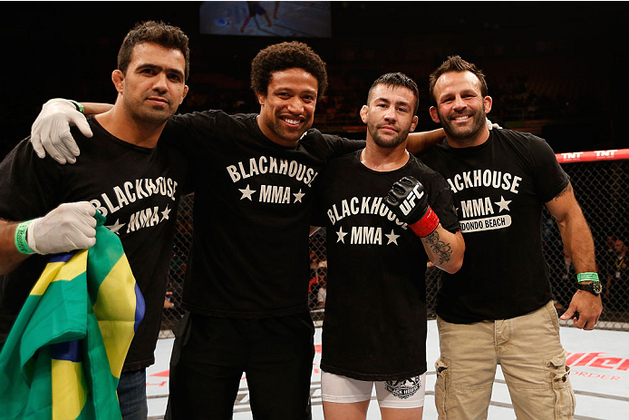 SAO PAULO, BRAZIL - MAY 31: Pedro Munhoz (2nd-R) reacts after his TKO victory over Matt Hobar in their bantamweight fight during the UFC Fight Night event at the Ginasio do Ibirapuera on May 31, 2014 in Sao Paulo, Brazil. (Photo by Josh Hedges/Zuffa LLC/Z