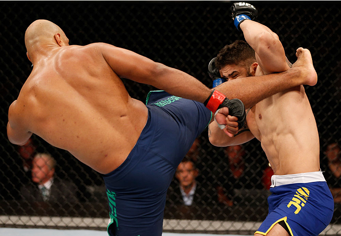 SAO PAULO, BRAZIL - MAY 31: (L-R) Marcos Rogerio de Lima kicks Richardson Moreira in their heavyweight fight during the UFC Fight Night event at the Ginasio do Ibirapuera on May 31, 2014 in Sao Paulo, Brazil. (Photo by Josh Hedges/Zuffa LLC/Zuffa LLC via
