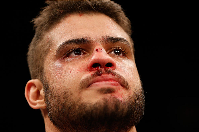 SAO PAULO, BRAZIL - MAY 31: Richardson Moreira reacts after his knockout loss to Marcos Rogerio de Lima in their heavyweight fight during the UFC Fight Night event at the Ginasio do Ibirapuera on May 31, 2014 in Sao Paulo, Brazil. (Photo by Josh Hedges/Zu