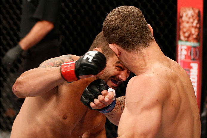 SAO PAULO, BRAZIL - MAY 31: (L-R) Ricardo Abreu punches Wagner Silva in their middleweight fight during the UFC Fight Night event at the Ginasio do Ibirapuera on May 31, 2014 in Sao Paulo, Brazil. (Photo by Josh Hedges/Zuffa LLC/Zuffa LLC via Getty Images