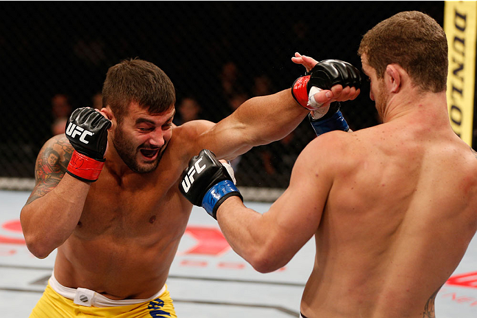 SAO PAULO, BRAZIL - MAY 31: (L-R) Ricardo Abreu punches Wagner Silva in their middleweight fight during the UFC Fight Night event at the Ginasio do Ibirapuera on May 31, 2014 in Sao Paulo, Brazil. (Photo by Josh Hedges/Zuffa LLC/Zuffa LLC via Getty Images