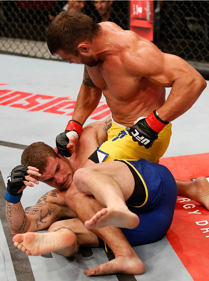 SAO PAULO, BRAZIL - MAY 31: (R-L) Ricardo Abreu punches Wagner Silva in their middleweight fight during the UFC Fight Night event at the Ginasio do Ibirapuera on May 31, 2014 in Sao Paulo, Brazil. (Photo by Josh Hedges/Zuffa LLC/Zuffa LLC via Getty Images