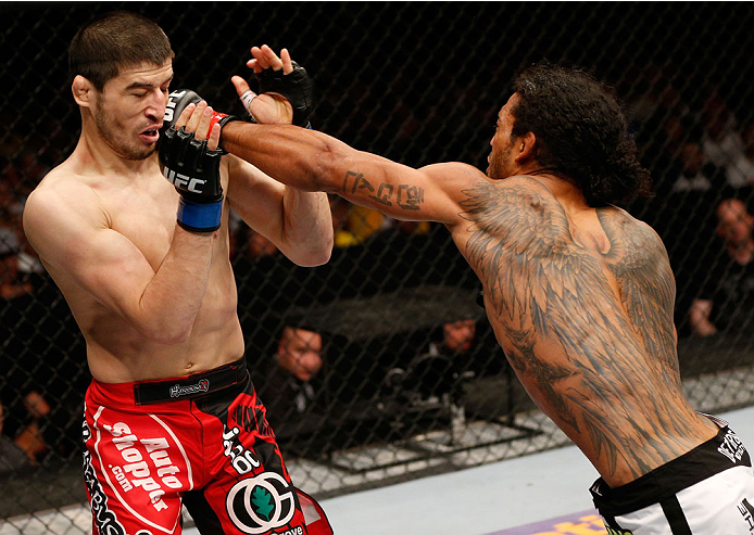 ALBUQUERQUE, NM - JUNE 07:  (R-L) Benson Henderson punches Rustam Khabilov in their lightweight fight during the UFC Fight Night event at Tingley Coliseum on June 7, 2014 in Albuquerque, New Mexico.  (Photo by Josh Hedges/Zuffa LLC/Zuffa LLC via Getty Ima