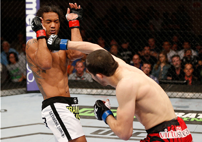 ALBUQUERQUE, NM - JUNE 07:  (R-L) Rustam Khabilov punches Benson Henderson in their lightweight fight during the UFC Fight Night event at Tingley Coliseum on June 7, 2014 in Albuquerque, New Mexico.  (Photo by Josh Hedges/Zuffa LLC/Zuffa LLC via Getty Ima