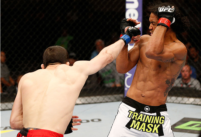 ALBUQUERQUE, NM - JUNE 07:  (L-R) Rustam Khabilov punches Benson Henderson in their lightweight fight during the UFC Fight Night event at Tingley Coliseum on June 7, 2014 in Albuquerque, New Mexico.  (Photo by Josh Hedges/Zuffa LLC/Zuffa LLC via Getty Ima