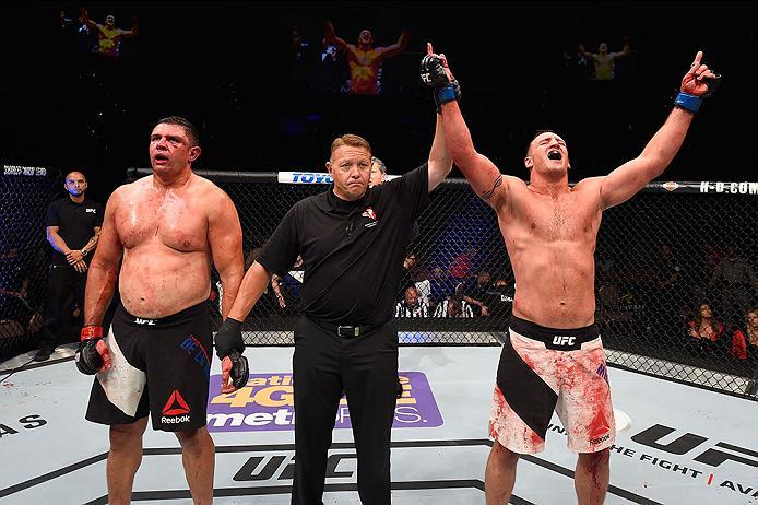 LAS VEGAS, NV - MAY 29: Adam Milstead (right) reacts to his victory over Chris De La Rocha (left) in their heavyweight bout during the UFC Fight Night event inside the Mandalay Bay Events Center on May 29, 2016 in Las Vegas, Nevada. (Photo by Josh Hedges